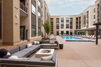 Designer pool with courtyard, cabanas, fire features & an outdoor kitchen area